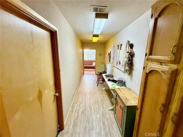 1900 Teton Way, Pine Mountain Club, CA 93222 - hallway featuring light wood-style flooring and a textured ceiling