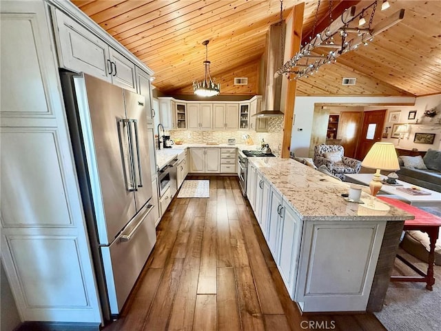 1900 Teton Way, Pine Mountain Club, CA 93222 - kitchen featuring premium appliances, vaulted ceiling, wood ceiling, open floor plan, and glass insert cabinets