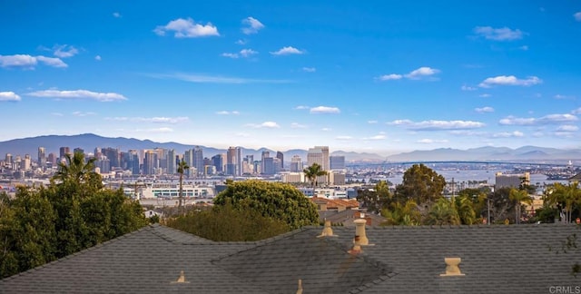 view of mountain background featuring nearby urban area