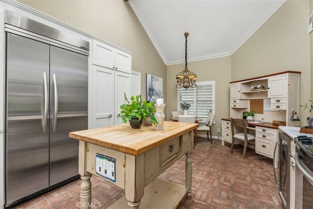 19 Rollins Pl, Laguna Niguel, CA 92677 - kitchen featuring appliances with stainless steel finishes, wooden counters, ornamental molding, high vaulted ceiling, and white cabinetry