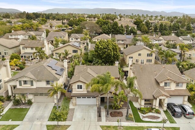 aerial perspective of suburban area featuring mountains