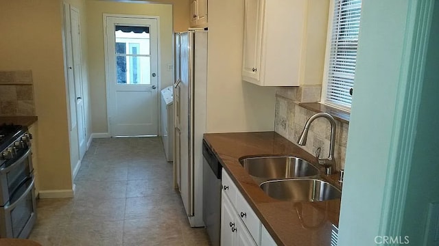 527 S Orchard Dr, Burbank, CA 91506 - kitchen with appliances with stainless steel finishes, plenty of natural light, white cabinetry, and light tile patterned floors