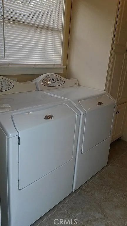 527 S Orchard Dr, Burbank, CA 91506 - laundry area with washer and clothes dryer and tile patterned flooring