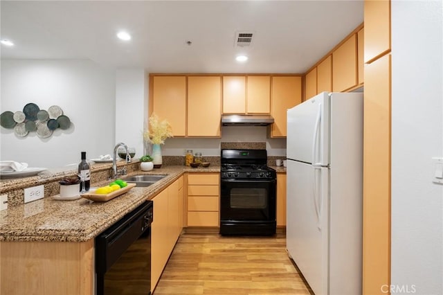160 S Hudson Ave Unit 202, Pasadena, CA 91101 - kitchen with black appliances, under cabinet range hood, a sink, light brown cabinetry, and light wood-type flooring
