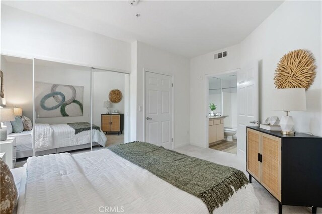160 S Hudson Ave Unit 202, Pasadena, CA 91101 - bedroom featuring light carpet, a closet, and ensuite bath