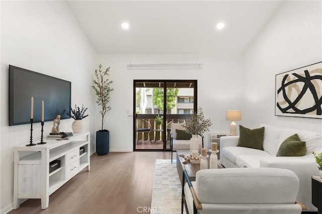 20702 El Toro Rd Unit 300, Lake Forest, CA 92630 - living area with wood finished floors, recessed lighting, vaulted ceiling, and baseboards
