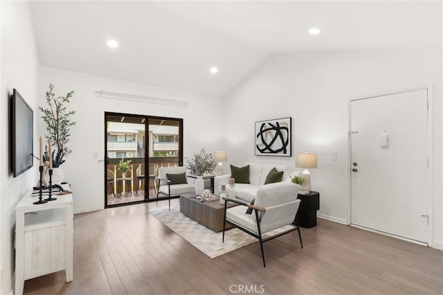 20702 El Toro Rd Unit 300, Lake Forest, CA 92630 - living area featuring vaulted ceiling, wood finished floors, recessed lighting, and baseboards