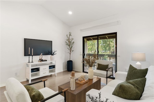 20702 El Toro Rd Unit 300, Lake Forest, CA 92630 - living room featuring wood finished floors, vaulted ceiling, baseboards, and recessed lighting
