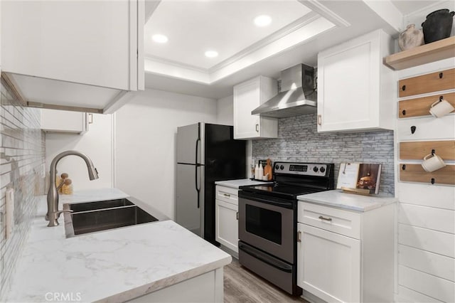 20702 El Toro Rd Unit 300, Lake Forest, CA 92630 - kitchen with electric range, wall chimney range hood, a sink, freestanding refrigerator, and open shelves