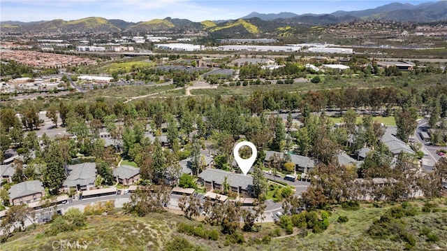 20702 El Toro Rd Unit 300, Lake Forest, CA 92630 - aerial view of property's location featuring a mountain backdrop and nearby suburban area