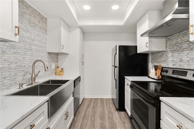 20702 El Toro Rd Unit 300, Lake Forest, CA 92630 - kitchen with stainless steel appliances, wall chimney exhaust hood, a raised ceiling, tasteful backsplash, and a sink
