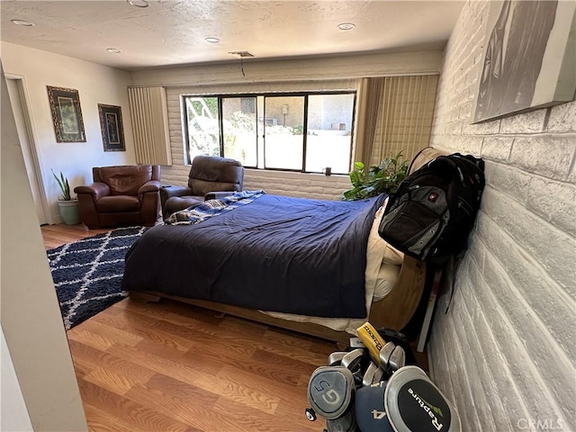 bedroom with wood finished floors