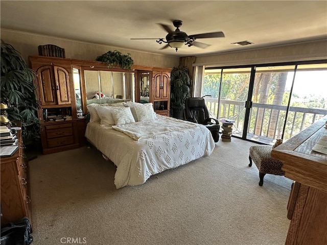 bedroom with access to outside, carpet, and a ceiling fan