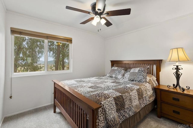 bedroom featuring carpet flooring, ornamental molding, baseboards, and ceiling fan