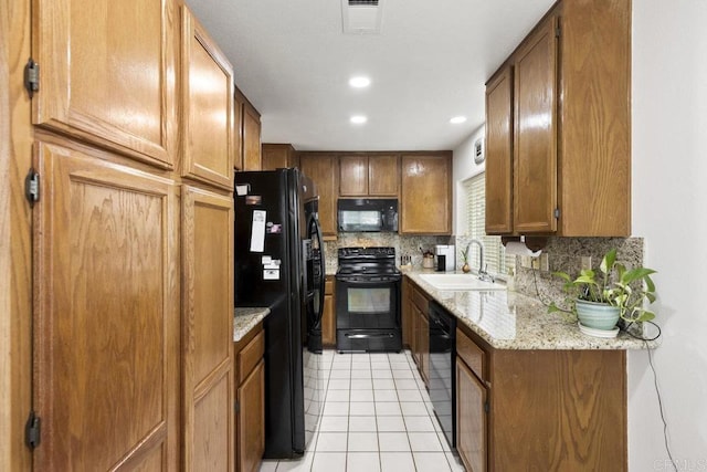 9501 High Park Ln, San Diego, CA 92129 - kitchen with black appliances, tasteful backsplash, light tile patterned floors, recessed lighting, and brown cabinetry