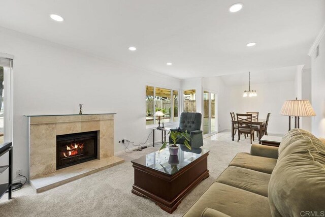 9501 High Park Ln, San Diego, CA 92129 - carpeted living area featuring recessed lighting, a fireplace, and a chandelier