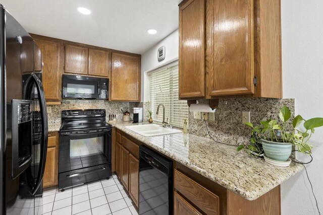 9501 High Park Ln, San Diego, CA 92129 - kitchen featuring black appliances, decorative backsplash, light tile patterned floors, brown cabinets, and recessed lighting