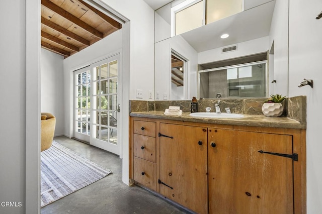full bathroom with finished concrete flooring, wood ceiling, a stall shower, vanity, and tasteful backsplash