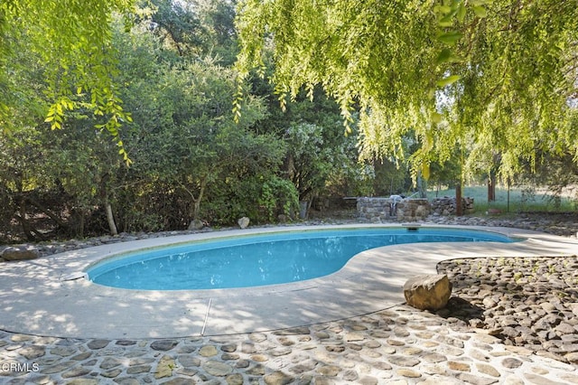 outdoor pool with a patio