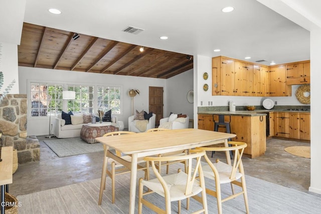 dining room featuring concrete flooring, recessed lighting, and wooden ceiling