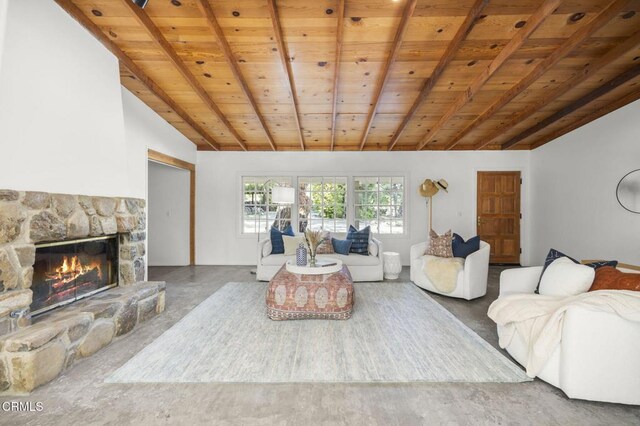 living room featuring wood ceiling and a fireplace