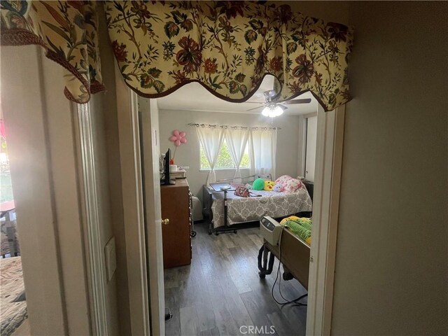 bedroom with wood finished floors and ceiling fan