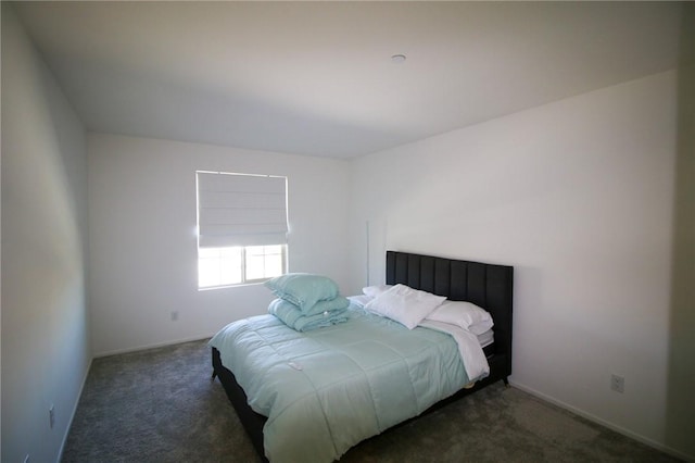 carpeted bedroom with baseboards