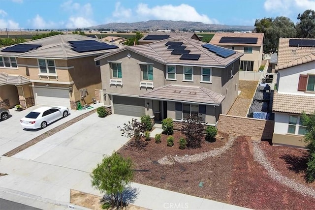 3409 Spring Wheat St, Perris, CA 92570 - view of front of home with an attached garage, concrete driveway, a residential view, and stucco siding