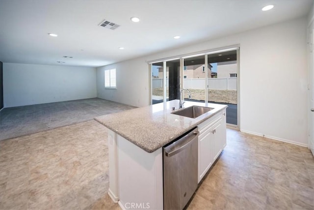 3409 Spring Wheat St, Perris, CA 92570 - kitchen with a sink, dishwasher, white cabinetry, a kitchen island with sink, and light stone countertops