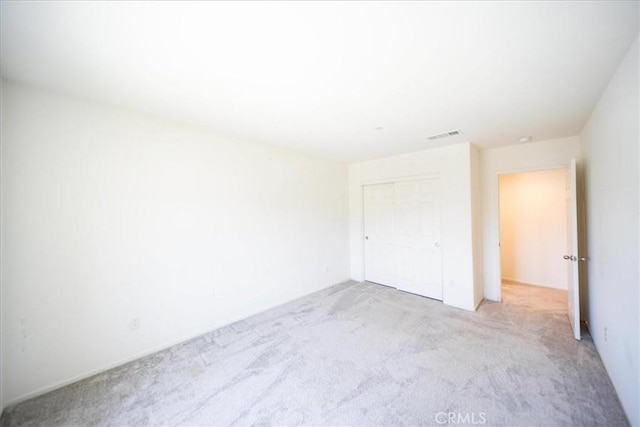 3409 Spring Wheat St, Perris, CA 92570 - unfurnished bedroom featuring light carpet and a closet
