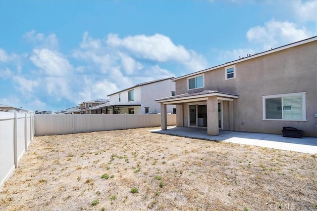 3409 Spring Wheat St, Perris, CA 92570 - fenced backyard featuring a patio area
