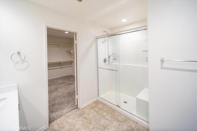 3409 Spring Wheat St, Perris, CA 92570 - full bathroom featuring a shower stall, a spacious closet, and recessed lighting