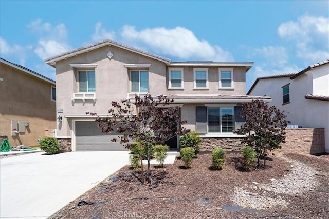 3409 Spring Wheat St, Perris, CA 92570 - traditional-style home featuring stucco siding, concrete driveway, an attached garage, and stone siding