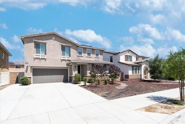 3409 Spring Wheat St, Perris, CA 92570 - view of front of house with concrete driveway, a garage, stucco siding, and stone siding