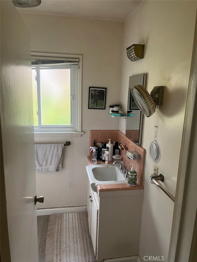 5134 Veronica St, Los Angeles, CA 90008 - bathroom featuring vanity and tasteful backsplash