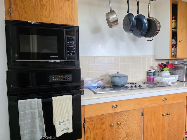 5134 Veronica St, Los Angeles, CA 90008 - kitchen with black appliances, light countertops, and backsplash