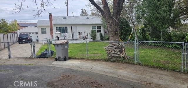 1409 Dobros Dr, West Sacramento, CA 95605 - single story home with a gate, a chimney, and a detached garage