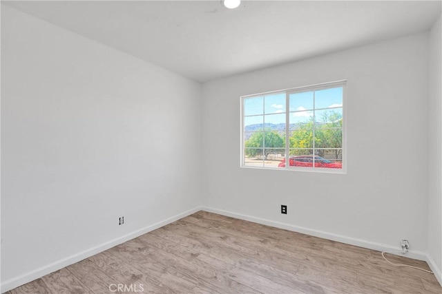 71854 El Paseo Dr Unit 29, Palms, CA 92277 - spare room with baseboards and light wood-style floors