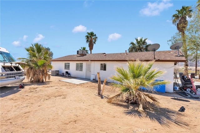 71854 El Paseo Dr Unit 29, Palms, CA 92277 - rear view of house with stucco siding and a patio area