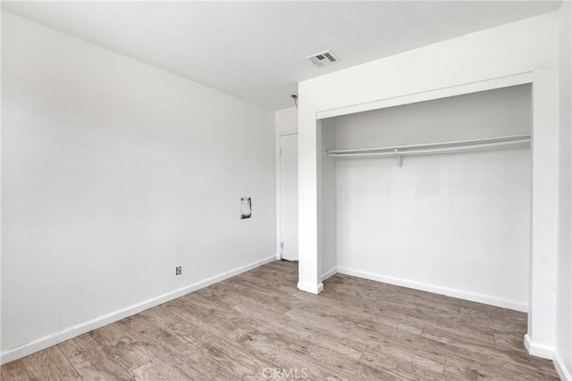 71854 El Paseo Dr Unit 29, Palms, CA 92277 - unfurnished bedroom featuring wood finished floors, a closet, and baseboards