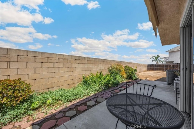 27559 Avenida Interno, Menifee, CA 92585 - view of patio / terrace with a fenced backyard and central AC unit