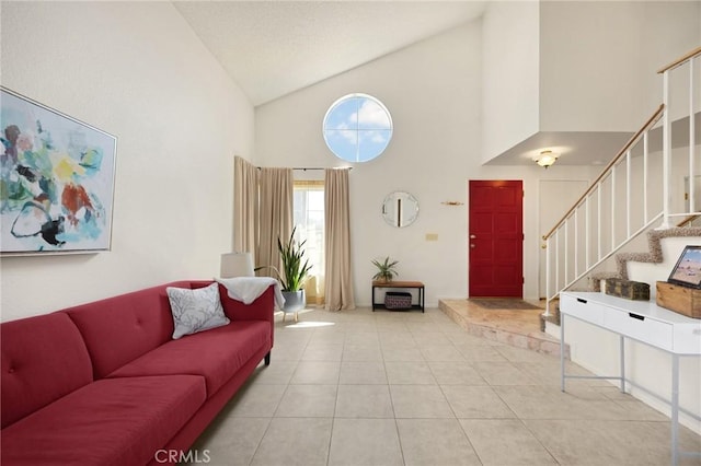 27559 Avenida Interno, Menifee, CA 92585 - living area with high vaulted ceiling, stairway, and light tile patterned flooring