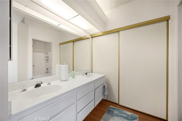 27559 Avenida Interno, Menifee, CA 92585 - full bathroom featuring double vanity, wood finished floors, and tub / shower combination