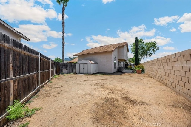 27559 Avenida Interno, Menifee, CA 92585 - fenced backyard featuring a storage unit and an outbuilding