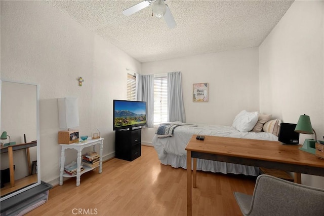 27559 Avenida Interno, Menifee, CA 92585 - bedroom with a textured ceiling, light wood-style floors, and a ceiling fan