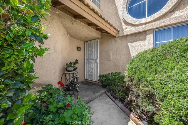 27559 Avenida Interno, Menifee, CA 92585 - doorway to property featuring stucco siding