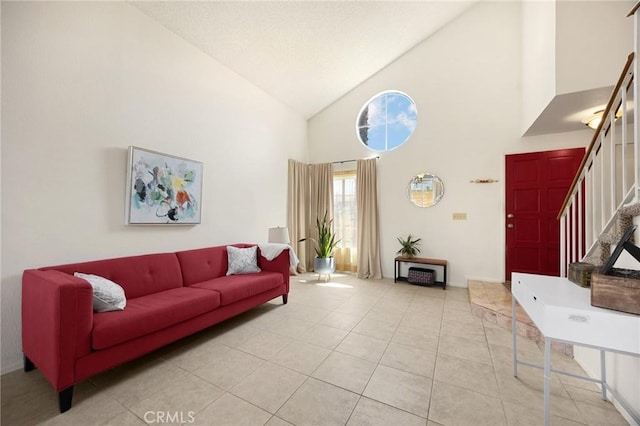 27559 Avenida Interno, Menifee, CA 92585 - tiled living room with stairway, high vaulted ceiling, and baseboards