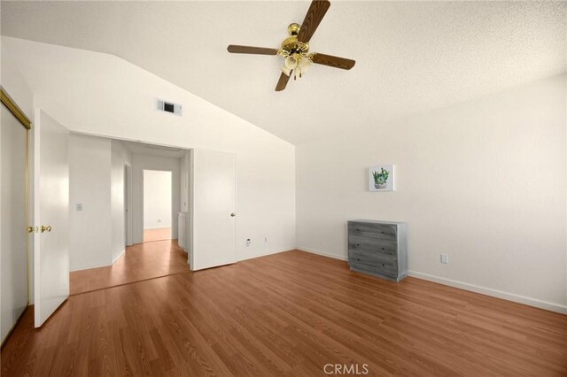 27559 Avenida Interno, Menifee, CA 92585 - spare room with a ceiling fan, wood finished floors, vaulted ceiling, and baseboards