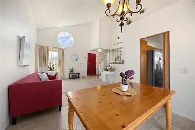 27559 Avenida Interno, Menifee, CA 92585 - dining space with stairway, light tile patterned flooring, high vaulted ceiling, and a chandelier