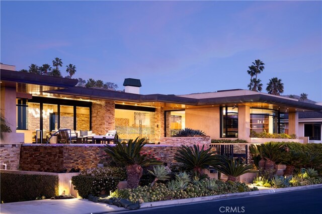 2526 Riviera Dr, Laguna Beach, CA 92651 - back of house with a chimney and an outdoor living space